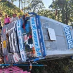 Overturned-Bus-on-Forested-Hillside